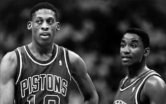 LOS ANGELES - 1987: Dennis Rodman #10 and Isiah Thomas #11 of the Detroit Pistons look on against the Los Angeles Clippers during a game circa 1987 at the Los Angeles Memorial Sports Arena in Los Angeles, California. NOTE TO USER: User expressly acknowledges and agrees that, by downloading and or using this photograph, User is consenting to the terms and conditions of the Getty Images License Agreement. Mandatory Copyright Notice: Copyright 1987 NBAE (Photo by Andrew D. Bernstein/NBAE via Getty Images)