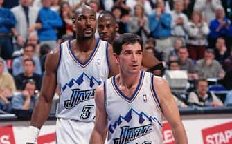 SALT LAKE CITY, UT - DECEMBER 5: Karl Malone #32 and John Stockton #12 of the Utah Jazz stand against the Toronto Raptors on December 5, 2000 at the Delta Center in Salt Lake City, Utah. Karl Malone moved into second place on the NBA's all-time scoring list during this game.  NOTE TO USER: User expressly acknowledges and agrees that, by downloading and or using this photograph, User is consenting to the terms and conditions of the Getty Images License Agreement. Mandatory Copyright Notice: Copyright 1988 NBAE (Photo by Andy Hayt/NBAE via Getty Images)