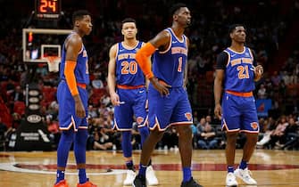 MIAMI, FLORIDA - DECEMBER 20:  Frank Ntilikina #11, Kevin Knox II #20, Bobby Portis #1, and Damyean Dotson #21 of the New York Knicks react against the Miami Heat during the second half at American Airlines Arena on December 20, 2019 in Miami, Florida. NOTE TO USER: User expressly acknowledges and agrees that, by downloading and/or using this photograph, user is consenting to the terms and conditions of the Getty Images License Agreement.  (Photo by Michael Reaves/Getty Images)