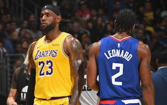 LOS ANGELES, CA - OCTOBER 22: LeBron James #23 of the Los Angeles Lakers and Kawhi Leonard #2 of the LA Clippers walk on the court on October 22, 2019 at STAPLES Center in Los Angeles, California. NOTE TO USER: User expressly acknowledges and agrees that, by downloading and/or using this Photograph, user is consenting to the terms and conditions of the Getty Images License Agreement. Mandatory Copyright Notice: Copyright 2019 NBAE (Photo by Andrew D. Bernstein/NBAE via Getty Images)