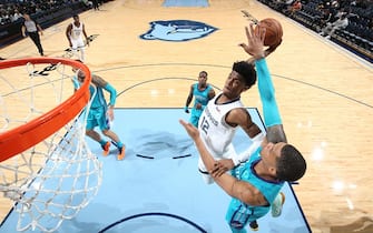 MEMPHIS, TN - OCTOBER 14: Ja Morant #12 of the Memphis Grizzlies dunks the ball against the Charlotte Hornets during a pre-season game on October 14, 2019 at FedExForum in Memphis, Tennessee. NOTE TO USER: User expressly acknowledges and agrees that, by downloading and or using this photograph, User is consenting to the terms and conditions of the Getty Images License Agreement. Mandatory Copyright Notice: Copyright 2019 NBAE (Photo by Joe Murphy/NBAE via Getty Images)