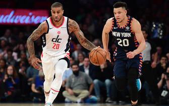NEW YORK, NEW YORK - DECEMBER 23: Gary Payton II #20 of the Washington Wizards drives past Kevin Knox II #20 of the New York Knicks during the first half of their game at Madison Square Garden on December 23, 2019 in New York City. NOTE TO USER: User expressly acknowledges and agrees that, by downloading and or using this photograph, User is consenting to the terms and conditions of the Getty Images License Agreement. (Photo by Emilee Chinn/Getty Images)