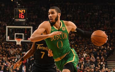TORONTO, CANADA - DECEMBER 25: Jayson Tatum #0 of the Boston Celtics handles the ball against the Toronto Raptors on December 25, 2019 at the Scotiabank Arena in Toronto, Ontario, Canada.  NOTE TO USER: User expressly acknowledges and agrees that, by downloading and or using this Photograph, user is consenting to the terms and conditions of the Getty Images License Agreement.  Mandatory Copyright Notice: Copyright 2019 NBAE (Photo by Ron Turenne/NBAE via Getty Images)