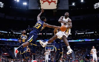 NEW ORLEANS, LOUISIANA - OCTOBER 11: Zion Williamson #1 of the New Orleans Pelicans is fouled by Royce O'Neale #23 of the Utah Jazz during a game at the Smoothie King Center on October 11, 2019 in New Orleans, Louisiana. NOTE TO USER: User expressly acknowledges and agrees that, by downloading and or using this Photograph, user is consenting to the terms and conditions of the Getty Images License Agreement.  (Photo by Jonathan Bachman/Getty Images)