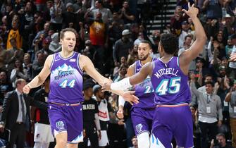 SALT LAKE CITY, UT - DECEMBER 26: Bojan Bogdanovic #44 of the Utah Jazz and Donovan Mitchell #45 of the Utah Jazz high-five during a game against the Portland Trail Blazers on December 26, 2019 at vivint.SmartHome Arena in Salt Lake City, Utah. NOTE TO USER: User expressly acknowledges and agrees that, by downloading and or using this Photograph, User is consenting to the terms and conditions of the Getty Images License Agreement. Mandatory Copyright Notice: Copyright 2019 NBAE (Photo by Melissa Majchrzak/NBAE via Getty Images)