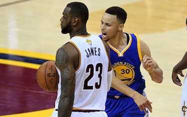 CLEVELAND, OH - JUNE 16:  Stephen Curry #30 of the Golden State Warriors reacts to a foul call during the fourth quarter as LeBron James #23 of the Cleveland Cavaliers looks on in Game 6 of the 2016 NBA Finals at Quicken Loans Arena on June 16, 2016 in Cleveland, Ohio. NOTE TO USER: User expressly acknowledges and agrees that, by downloading and or using this photograph, User is consenting to the terms and conditions of the Getty Images License Agreement.  (Photo by Jason Miller/Getty Images)