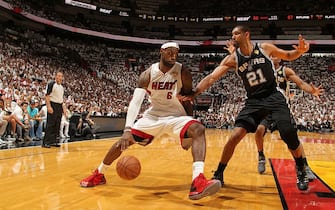 MIAMI, FL - JUNE 20:  LeBron James #6 of the Miami Heat drives against Tim Duncan #21 of the San Antonio Spurs during Game Seven of the 2013 NBA Finals on June 20, 2013 at American Airlines Arena in Miami, Florida. NOTE TO USER: User expressly acknowledges and agrees that, by downloading and or using this photograph, User is consenting to the terms and conditions of the Getty Images License Agreement. Mandatory Copyright Notice: Copyright 2013 NBAE (Photo by Issac Baldizon/NBAE via Getty Images)