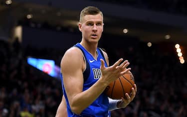 MILWAUKEE, WISCONSIN - DECEMBER 16:  Kristaps Porzingis #6 of the Dallas Mavericks reacts to an officials call during the first half of a game against the Milwaukee Bucks at Fiserv Forum on December 16, 2019 in Milwaukee, Wisconsin. NOTE TO USER: User expressly acknowledges and agrees that, by downloading and or using this photograph, User is consenting to the terms and conditions of the Getty Images License Agreement. (Photo by Stacy Revere/Getty Images)