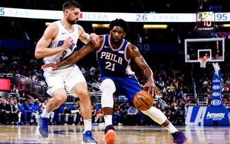 ORLANDO, FLORIDA - DECEMBER 27: Nikola Vucevic #9 of the Orlando Magic and Joel Embiid #21 of the Philadelphia 76ers face off in the third quarter at Amway Center on December 27, 2019 in Orlando, Florida. NOTE TO USER: User expressly acknowledges and agrees that, by downloading and/or using this photograph, user is consenting to the terms and conditions of the Getty Images License Agreement.  (Photo by Harry Aaron/Getty Images)