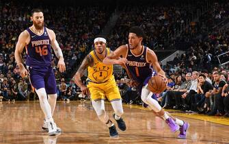 SAN FRANCISCO, CA - DECEMBER 27: Devin Booker #1 of the Phoenix Suns handles the ball against the Golden State Warriors on December 27, 2019 at Chase Center in San Francisco, California. NOTE TO USER: User expressly acknowledges and agrees that, by downloading and or using this photograph, user is consenting to the terms and conditions of Getty Images License Agreement. Mandatory Copyright Notice: Copyright 2019 NBAE (Photo by Noah Graham/NBAE via Getty Images)