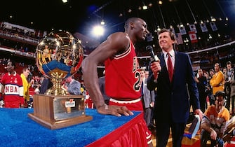 CHICAGO- FEBRUARY 6: Michael Jordan #23 of the Chicago Bulls poses with the trophy after winning the 1988 Slam Dunk Contest as part of All-Star Weekend on February 6, 1988 at Chicago Stadium in Chicago, Illinois . NOTE TO USER: User expressly acknowledges and agrees that, by downloading and or using this photograph, User is consenting to the terms and conditions of the Getty Images License Agreement. Mandatory Copyright Notice: Copyright 1988 NBAE (Photo by Andrew D. Bernstein/NBAE via Getty Images)