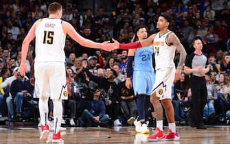 DENVER, CO - DECEMBER 28: Nikola Jokic #15 of the Denver Nuggets high-fives Gary Harris #14 of the Denver Nuggets against the Memphis Grizzlies on December 28, 2019 at the Pepsi Center in Denver, Colorado. NOTE TO USER: User expressly acknowledges and agrees that, by downloading and/or using this Photograph, user is consenting to the terms and conditions of the Getty Images License Agreement. Mandatory Copyright Notice: Copyright 2019 NBAE (Photo by Bart Young/NBAE via Getty Images)