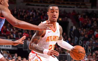 CHICAGO, IL - DECEMBER 28: John Collins #20 of the Atlanta Hawks handles the ball against the Chicago Bulls on December 28, 2019 at the United Center in Chicago, Illinois. NOTE TO USER: User expressly acknowledges and agrees that, by downloading and or using this photograph, user is consenting to the terms and conditions of the Getty Images License Agreement.  Mandatory Copyright Notice: Copyright 2019 NBAE (Photo by Bill Baptist/NBAE via Getty Images)