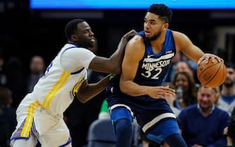 MINNEAPOLIS, MN - MARCH 11: Draymond Green #23 of the Golden State Warriors defends against Karl-Anthony Towns #32 of the Minnesota Timberwolves during the game on March 11, 2018 at the Target Center in Minneapolis, Minnesota. NOTE TO USER: User expressly acknowledges and agrees that, by downloading and or using this Photograph, user is consenting to the terms and conditions of the Getty Images License Agreement. (Photo by Hannah Foslien/Getty Images)