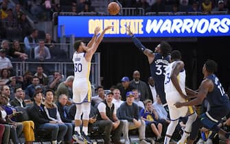 SAN FRANCISCO, CALIFORNIA - OCTOBER 10: Stephen Curry #30 of the Golden State Warriors shoots a three-point shot over Robert Covington #33 of the Minnesota Timberwolves during an NBA basketball game at Chase Center on October 10, 2019 in San Francisco, California. NOTE TO USER: User expressly acknowledges and agrees that, by downloading and or using this photograph, User is consenting to the terms and conditions of the Getty Images License Agreement. (Photo by Thearon W. Henderson/Getty Images)