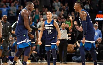 MINNEAPOLIS, MINNESOTA - DECEMBER 30: (L-R) Gorgui Dieng #5, Shabazz Napier #13 and Robert Covington #33 of the Minnesota Timberwolves celebrate a a three-point basket by Dieng against the Brooklyn Nets in the final minute of the fourth quarter in the game at Target Center on December 30, 2019 in Minneapolis, Minnesota. The Timberwolves defeated the Nets 122-115. NOTE TO USER: User expressly acknowledges and agrees that, by downloading and or using this Photograph, user is consenting to the terms and conditions of the Getty Images License Agreement (Photo by Hannah Foslien/Getty Images)