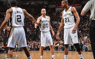 170713898 SAN ANTONIO, TX - JUNE 16: Kawhi Leonard #2, Manu Ginobili #20 and Tim Duncan #21 of the San Antonio Spurs prepares against the Miami Heat during Game Five of the 2013 NBA Finals on June 16, 2013 at AT&T Center in San Antonio, Texas. NOTE TO USER: User expressly acknowledges and agrees that, by downloading and or using this photograph, User is consenting to the terms and conditions of the Getty Images License Agreement. Mandatory Copyright Notice: Copyright 2013 NBAE (Photo by Jesse D. Garrabrant/NBAE via Getty Images)