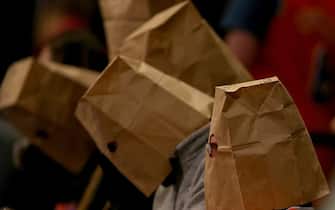 NEW YORK, NY - JANUARY 08:  New York Knicks fans wear bags over their heads and react as the New York Knicks lose at Madison Square Garden on January 8, 2015 in New York City.The Houston Rockets defeated the New York Knicks 120-96. NOTE TO USER: User expressly acknowledges and agrees that, by downloading and/or using this photograph, user is consenting to the terms and conditions of the Getty Images License Agreement.  (Photo by Elsa/Getty Images)
