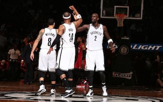BROOKLYN, NY - MAY 12: Paul Pierce #34, Kevin Garnett #2, and Deron Williams #8 of the Brooklyn Nets celebrate in Game Four of the Eastern Conference Semifinals against the Miami Heat during the 2014 NBA Playoffs on May 12, 2014 at Barclays Center in Brooklyn. NOTE TO USER: User expressly acknowledges and agrees that, by downloading and or using this photograph, User is consenting to the terms and conditions of the Getty Images License Agreement. Mandatory Copyright Notice: Copyright 2014 NBAE (Photo by Nathaniel S. Butler/NBAE via Getty Images)