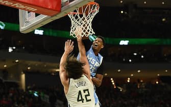 1197042368 MILWAUKEE, WISCONSIN - JANUARY 01: Jarrett Culver #23 of the Minnesota Timberwolves dunks over Robin Lopez #42 of the Milwaukee Bucks during the second half at Fiserv Forum on January 01, 2020 in Milwaukee, Wisconsin. NOTE TO USER: User expressly acknowledges and agrees that, by downloading and or using this photograph, User is consenting to the terms and conditions of the Getty Images License Agreement. (Photo by Stacy Revere/Getty Images)