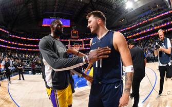 DALLAS, TX - NOVEMBER 1: LeBron James #23 of the Los Angeles Lakers hi-fives Luka Doncic #77 of the Dallas Mavericks after the game on November 1, 2019 at the American Airlines Center in Dallas, Texas. NOTE TO USER: User expressly acknowledges and agrees that, by downloading and/or using this Photograph, user is consenting to the terms and conditions of the Getty Images License Agreement. Mandatory Copyright Notice: Copyright 2019 NBAE (Photo by Jesse D. Garrabrant/NBAE via Getty Images)