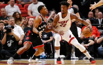 MIAMI, FLORIDA - JANUARY 02:  Jimmy Butler #22 of the Miami Heat drives to the basket against Kyle Lowry #7 of the Toronto Raptors during the first half at American Airlines Arena on January 02, 2020 in Miami, Florida. NOTE TO USER: User expressly acknowledges and agrees that, by downloading and/or using this photograph, user is consenting to the terms and conditions of the Getty Images License Agreement. (Photo by Michael Reaves/Getty Images)