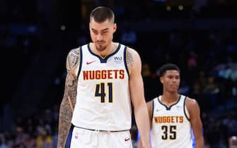 DENVER, COLORADO - OCTOBER 17: Juancho Hernangomez #41 and PJ Dozier #35 of the Denver Nuggets return to the court against the Portland Trail Blazers at Pepsi Center on October 17, 2019 in Denver, Colorado. NOTE TO USER: User expressly acknowledges and agrees that, by downloading and or using this photograph, User is consenting to the terms and conditions of the Getty Images License Agreement.  (Photo by Lizzy Barrett/Getty Images)