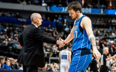 DALLAS, TX - MARCH 26: (EDITORS NOTE: Image has been digitally enhanced) Luka Doncic #77 and Rick Carlisle of the Dallas Mavericks shake hands against the Sacramento Kings on March 26, 2019 at the American Airlines Center in Dallas, Texas. NOTE TO USER: User expressly acknowledges and agrees that, by downloading and or using this photograph, User is consenting to the terms and conditions of the Getty Images License Agreement. Mandatory Copyright Notice: Copyright 2019 NBAE (Photo by Sean Berry/NBAE via Getty Images)