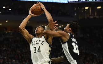 1197576467 MILWAUKEE, WISCONSIN - JANUARY 04: Giannis Antetokounmpo #34 of the Milwaukee Bucks is fouled by DeMar DeRozan #10 of the San Antonio Spurs during the second half of a game at Fiserv Forum on January 04, 2020 in Milwaukee, Wisconsin. NOTE TO USER: User expressly acknowledges and agrees that, by downloading and or using this photograph, User is consenting to the terms and conditions of the Getty Images License Agreement. (Photo by Stacy Revere/Getty Images)