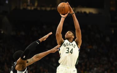 MILWAUKEE, WISCONSIN - JANUARY 04:  Giannis Antetokounmpo #34 of the Milwaukee Bucks shoots over Rudy Gay #22 of the San Antonio Spurs during the second half of a game at Fiserv Forum on January 04, 2020 in Milwaukee, Wisconsin. NOTE TO USER: User expressly acknowledges and agrees that, by downloading and or using this photograph, User is consenting to the terms and conditions of the Getty Images License Agreement. (Photo by Stacy Revere/Getty Images)