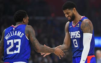 LOS ANGELES, CA - JANUARY 05: Lou Williams #23 and Paul George #13 of the LA Clippers celebrate in the second half against the New York Knicks at Staples Center on January 5, 2020 in Los Angeles, California. NOTE TO USER: User expressly acknowledges and agrees that, by downloading and/or using this photograph, user is consenting to the terms and conditions of the Getty Images License Agreement. Lakers won 117 to 107. (Photo by John McCoy/Getty Images)