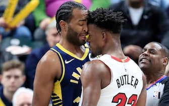 INDIANAPOLIS, INDIANA - JANUARY 08:  Jimmy Butler #22 of the Miami Heat and T.J. Warren #1 of  the Indiana Pacers get involved in an argument during the game at Bankers Life Fieldhouse on January 08, 2020 in Indianapolis, Indiana.    NOTE TO USER: User expressly acknowledges and agrees that, by downloading and or using this photograph, User is consenting to the terms and conditions of the Getty Images License Agreement. (Photo by Andy Lyons/Getty Images)