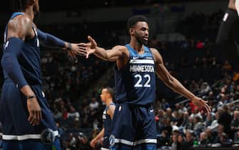 MINNEAPOLIS, MN -  JANUARY 9: Andrew Wiggins #22 of the Minnesota Timberwolves high fives a teammate during the game against the Portland Trail Blazers on January 9, 2020 at Target Center in Minneapolis, Minnesota. NOTE TO USER: User expressly acknowledges and agrees that, by downloading and or using this Photograph, user is consenting to the terms and conditions of the Getty Images License Agreement. Mandatory Copyright Notice: Copyright 2020 NBAE (Photo by David Sherman/NBAE via Getty Images)