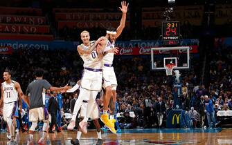 OKLAHOMA CITY, OK - JANUARY 11: JaVale McGee #7 of the Los Angeles Lakers and Kyle Kuzma #0 of the Los Angeles Lakers reacts to play against the Oklahoma City Thunder on January 11, 2020 at Chesapeake Energy Arena in Oklahoma City, Oklahoma. NOTE TO USER: User expressly acknowledges and agrees that, by downloading and or using this photograph, User is consenting to the terms and conditions of the Getty Images License Agreement. Mandatory Copyright Notice: Copyright 2020 NBAE (Photo by Jeff Haynes/NBAE via Getty Images)