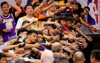 Fans reach out to players after the National Basketball Association (NBA) pre-season game between the Los Angeles Lakers and Brooklyn Nets in Shenzhen, in China's southern Guangdong province on October 12, 2019. (Photo by STR / AFP) / China OUT (Photo by STR/AFP via Getty Images)