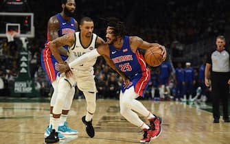 MILWAUKEE, WISCONSIN - NOVEMBER 23:  Derrick Rose #25 of the Detroit Pistons drives around George Hill #3 of the Milwaukee Bucks during a game at Fiserv Forum on November 23, 2019 in Milwaukee, Wisconsin. NOTE TO USER: User expressly acknowledges and agrees that, by downloading and or using this photograph, User is consenting to the terms and conditions of the Getty Images License Agreement. (Photo by Stacy Revere/Getty Images)