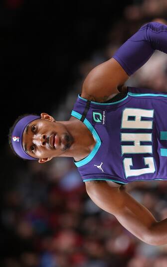 PORTLAND, OR - JANUARY 13: Devonte' Graham #4 of the Charlotte Hornets looks on against the Portland Trail Blazers on January 13, 2020 at the Moda Center Arena in Portland, Oregon. NOTE TO USER: User expressly acknowledges and agrees that, by downloading and or using this photograph, user is consenting to the terms and conditions of the Getty Images License Agreement. Mandatory Copyright Notice: Copyright 2020 NBAE (Photo by Sam Forencich/NBAE via Getty Images)
