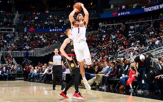 ATLANTA, GA - JANUARY 14:  Devin Booker #1 of the Phoenix Suns shoots the ball against the Atlanta Hawks on January 14, 2020 at State Farm Arena in Atlanta, Georgia.  NOTE TO USER: User expressly acknowledges and agrees that, by downloading and/or using this Photograph, user is consenting to the terms and conditions of the Getty Images License Agreement. Mandatory Copyright Notice: Copyright 2020 NBAE (Photo by Scott Cunningham/NBAE via Getty Images)