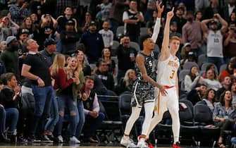 SAN ANTONIO, TX - JANUARY 17:  Kevin Huerter #3  of the Atlanta Hawks celebrates his game winning three next to Dejounte Murray #5 of the San Antonio Spurs during second half action at AT&T Center on January 17, 2020 in San Antonio, Texas.  Atlanta Hawks defeated the San Antonio Spurs 121-120. NOTE TO USER: User expressly acknowledges and agrees that ,by downloading and or using this photograph, User is consenting to the terms and conditions of the Getty Images License Agreement. (Photo by Ronald Cortes/Getty Images)