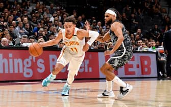 SAN ANTONIO, TX - JANUARY 17: Trae Young #11 of the Atlanta Hawks handles the ball against the San Antonio Spurs on January 17, 2020 at the AT&T Center in San Antonio, Texas. NOTE TO USER: User expressly acknowledges and agrees that, by downloading and or using this photograph, user is consenting to the terms and conditions of the Getty Images License Agreement. Mandatory Copyright Notice: Copyright 2020 NBAE (Photos by Logan Riely/NBAE via Getty Images)