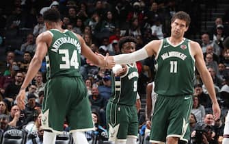 BROOKLYN, NY - JANUARY 18: Giannis Antetokounmpo #34, and Brook Lopez #11 of the Milwaukee Bucks hi-five each other during the game against the Brooklyn Nets on January 18, 2020 at Barclays Center in Brooklyn, New York. NOTE TO USER: User expressly acknowledges and agrees that, by downloading and or using this Photograph, user is consenting to the terms and conditions of the Getty Images License Agreement. Mandatory Copyright Notice: Copyright 2020 NBAE (Photo by Nathaniel S. Butler/NBAE via Getty Images)