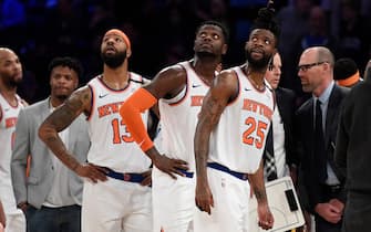 NEW YORK, NEW YORK - JANUARY 18: Reggie Bullock #25, Julius Randle #30, and Marcus Morris Sr. #13 of the New York Knicks wait for a decision during a replay review during the second half against the Philadelphia 76ers at Madison Square Garden on January 18, 2020 in New York City. NOTE TO USER: User expressly acknowledges and agrees that, by downloading and or using this photograph, User is consenting to the terms and conditions of the Getty Images License Agreement. (Photo by Sarah Stier/Getty Images)