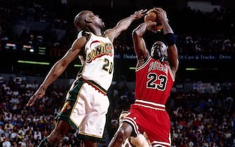 SEATTLE - JUNE 9:  Michael Jordan #23 of the Chicago Buls shoots a jump shot over Gary Payton #20 of the Seattle SuperSonics during game three of the 1996 NBA Finals played June 9, 1996 at the Key Arena in Seattle, Washington.  NOTE TO USER: User expressly acknowledges that, by downloading and or using this photograph, User is consenting to the terms and conditions of the Getty Images License agreement. Mandatory Copyright Notice: Copyright 1996 NBAE (Photo by Andrew D. Bernstein/NBAE via Getty Images)