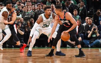 BOSTON, MA - FEBRUARY 27: Marcus Smart #36 of the Boston Celtics plays defense against CJ McCollum #3 of the Portland Trail Blazers on February 27, 2019 at the TD Garden in Boston, Massachusetts.  NOTE TO USER: User expressly acknowledges and agrees that, by downloading and or using this photograph, User is consenting to the terms and conditions of the Getty Images License Agreement. Mandatory Copyright Notice: Copyright 2019 NBAE  (Photo by Brian Babineau/NBAE via Getty Images)