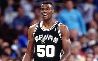 OAKLAND, CA - 1994: David Robinson #50 of the San Antonio Spurs looks on  circa 1994 at the Oakland Coliseum in Oakland, California. NOTE TO USER: User expressly acknowledges and agrees that, by downloading and or using this photograph, User is consenting to the terms and conditions of the Getty Images License Agreement. Mandatory Copyright Notice: Copyright 1994 NBAE (Photo by Martha Jane Stanton/NBAE via Getty Images)