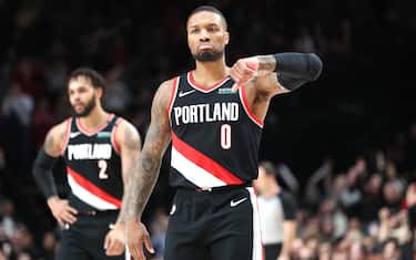 PORTLAND, OREGON - JANUARY 20: Damian Lillard #0 of the Portland Trail Blazers celebrates after making a three-point basket in the fourth quarter against the Golden State Warriors at Moda Center on January 20, 2020 in Portland, Oregon. NOTE TO USER: User expressly acknowledges and agrees that, by downloading and or using this photograph, User is consenting to the terms and conditions of the Getty Images License Agreement (Photo by Abbie Parr/Getty Images)  (Photo by Abbie Parr/Getty Images)