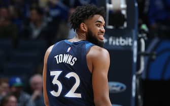 MINNEAPOLIS, MN - DECEMBER 11: Karl-Anthony Towns #32 of the Minnesota Timberwolves looks on against the Utah Jazz on December 11, 2019 at Target Center in Minneapolis, Minnesota. NOTE TO USER: User expressly acknowledges and agrees that, by downloading and or using this Photograph, user is consenting to the terms and conditions of the Getty Images License Agreement. Mandatory Copyright Notice: Copyright 2019 NBAE (Photo by David Sherman/NBAE via Getty Images)