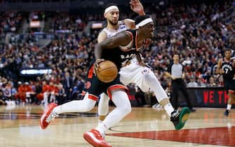 TORONTO, ON - JANUARY 22:  Pascal Siakam #43 of the Toronto Raptors drives to the net against Ben Simmons #25 of the Philadelphia 76ers during second half of their NBA game at Scotiabank Arena on January 22, 2020 in Toronto, Canada. NOTE TO USER: User expressly acknowledges and agrees that, by downloading and or using this photograph, User is consenting to the terms and conditions of the Getty Images License Agreement. (Photo by Cole Burston/Getty Images)