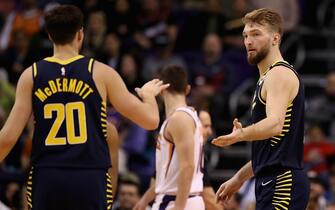 PHOENIX, ARIZONA - JANUARY 22: Domantas Sabonis #11 of the Indiana Pacers high fives Doug McDermott #20 after scoring against the Phoenix Suns during the second half of the NBA game at Talking Stick Resort Arena on January 22, 2020 in Phoenix, Arizona. NOTE TO USER: User expressly acknowledges and agrees that, by downloading and or using this photograph, user is consenting to the terms and conditions of the Getty Images License Agreement. Mandatory Copyright Notice: Copyright 2020 NBAE.  (Photo by Christian Petersen/Getty Images)