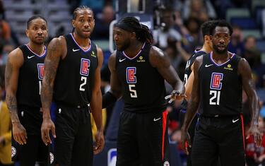 NEW ORLEANS, LOUISIANA - JANUARY 18: Kawhi Leonard #2 of the LA Clippers, Montrezl Harrell #5, Landry Shamet #20 and Patrick Beverley #21 talk during a game against the New Orleans Pelicans at the Smoothie King Center on January 18, 2020 in New Orleans, Louisiana. NOTE TO USER: User expressly acknowledges and agrees that, by downloading and or using this Photograph, user is consenting to the terms and conditions of the Getty Images License Agreement. (Photo by Jonathan Bachman/Getty Images)